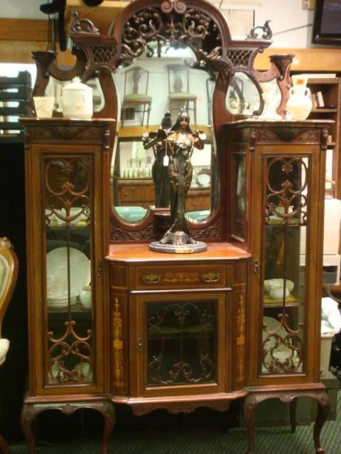 Elegant Edwardian Marquetry Inlaid Carved Étagère:: Elegant Edwardian Marquetry Inlaid Carved Étagère: Polychrome Floral and Classical Inlay on Center Cabinet with Open Carved Crown over Mirror Backed Inset Center. Cabinets at Sides are Glazed with L