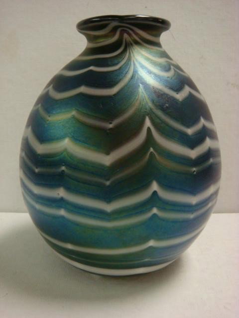 CHARLES LOTTON Ovoid Form Iridescent Vase:: CHARLES LOTTON Ovoid Form Iridescent Vase: Decorated with Alternating Cobalt and White Wave Pattern with Green Highlights. Crack in Bottom. Signed Lotton 1972. 8 1/4"T. Provenance: Lillian Nassau Coll