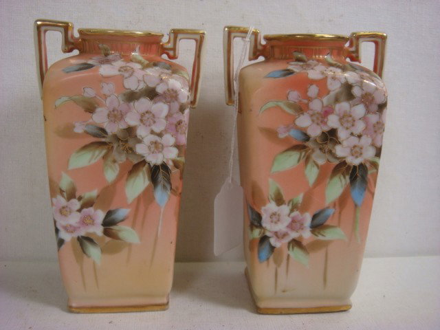 Pair of Handpainted NIPPON Handled Vases: : Pair of Handpainted NIPPON Handled Vases: Each 6"T Squared Vase with Upright Handles is Handpainted in Pink Floral with Green and Blue Leaves and Gold Accents. Green M in Wreath Mark. (100-200)