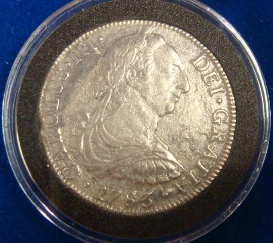 1783 8 Reale Silver Coin, America's First Dollar:: 1783 8 Reale Silver Coin, America's First Dollar: The Famous Piece of 8 or Pillar Dollar. 27.677 Grams of .903 Silver. In Display Box with Plastic Cover. Authenticated by Washington Mint with Certific