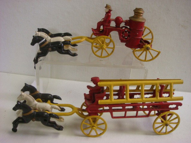 Two Cast Iron Horse Drawn Toy Fire Wagons:: Two Cast Iron Horse Drawn Toy Fire Wagons: Two Part Fire Wagons with Drivers and Team of 3 Horses. 10 1/2"L One has Broken Rear Wheel. One with Detachable Ladders is 11"L. (100-200)