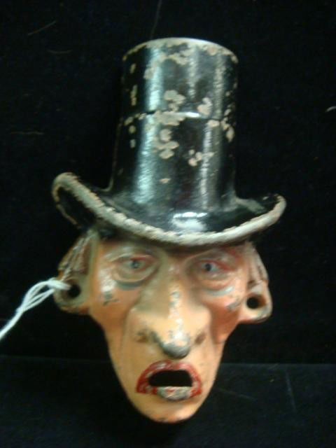 MR. DRY Cast Iron Bottle Opener: MR. DRY Cast Iron Bottle Opener: Man in Top Hat, Marked Wilton Rod. Black, Beige and Red Paint, Two Mounting Holes. 5.5"T, 3.5"W. About 20% Paint Loss. (100-180)