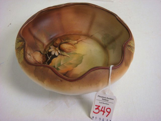 Handpainted NIPPON Molded In Relief Nut Bowl: Handpainted NIPPON Molded In Relief Nut Bowl: Scalloped and Cupped Rim Bowl has Handpainted Leaves and Nut with Raised Nut and Flower. Raised Rim and Leaves on Outer Rim. Green M in Wreath Mark. (60-1