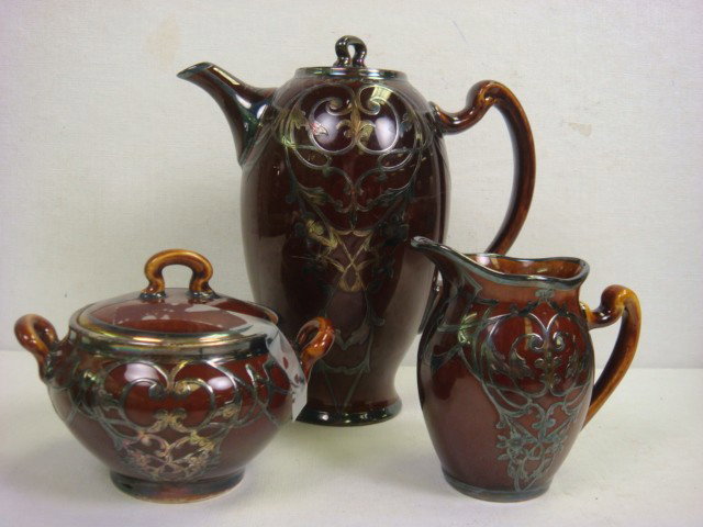 LENOX MAUSER Silver Overlay Teapot, Sugar, Creamer: LENOX MAUSER Silver Overlay Teapot, Sugar, Creamer: Double Handled Sugar with Lid and Handled Creamer. Green CAC Stamp with Unicorn. Teapot Same Design Marked England with Unicorn. Overlay of Violets