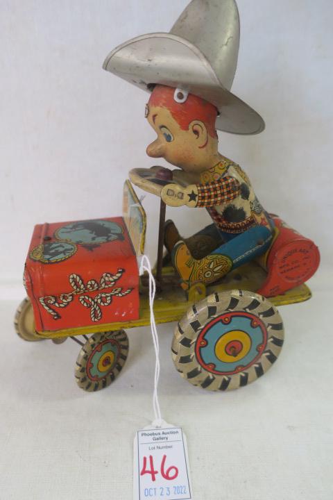 Tin Lithograph Rodeo Joe Unique Art Crazy Car Toy:: Tin Lithograph Rodeo Joe Unique Art Crazy Car Toy: 1930's Pressed Tin Litho of Rodeo Joe Dressed in Cowboy hat, Cow Print Vest, Jeans, Cowboy Boots, Holstered Gun . Decorated with "Yippee, Rodeo Joe, 