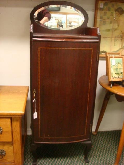 Mirror Back Mahogany Music Cabinet:: Mirror Back Mahogany Music Cabinet: 14"W X 18"D X 49"T. Has Band Inlaid Swell Front Door with Interior Sheet Music Shelves. Cabriole Legs and Oval Beveled Mirror Back Splash. (120-250)