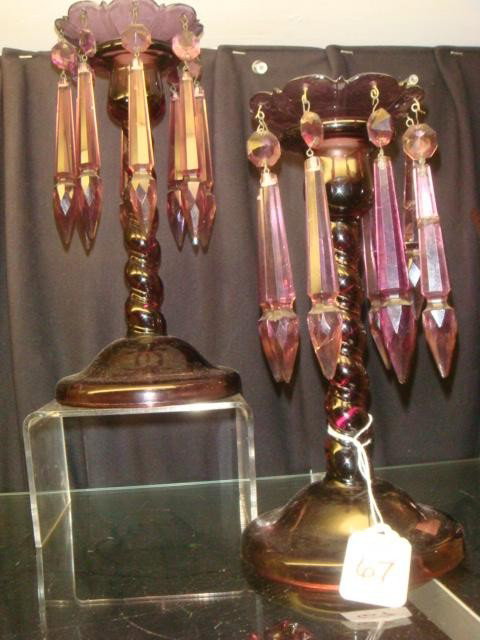 Pair of Purple Glass Candlesticks with Prisms:: Pair of Purple Glass Candlesticks with Prisms: Each 9"T Twist Stem Candlestick has Removable Bobeche with 8 Spear Prisms. One Bobeche is Damaged and Missing One Prism. (40-60)