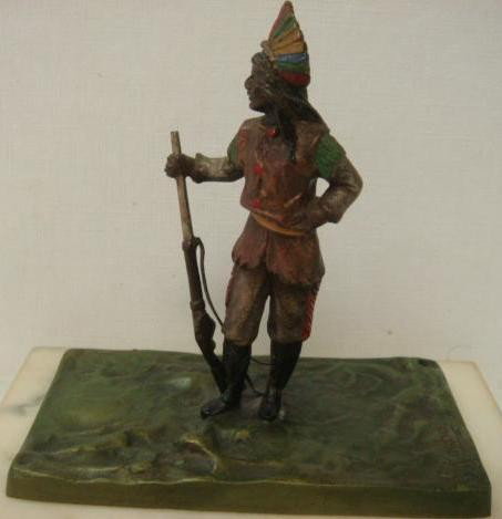 Polychrome Bronze Indian Figure Signed C. Kauba:: Polychrome Bronze Indian Figure Signed C. Kauba: Standing Indian with Rifle, Finely Detailed, 4" X 4" on 3/4" White Marble Plinth. Carl Kauba (American, 1865-1922) (600-800)