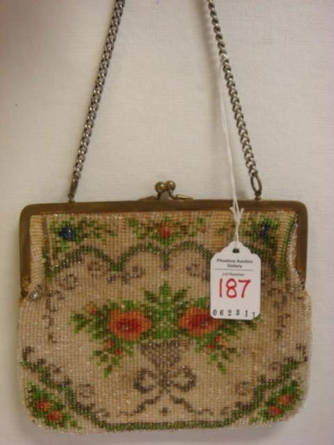 Vintage Floral Beaded Purse: Vintage Floral Beaded Purse: Goldtone Frame, Kiss Closure, Suede Lined with Pocket. Glass Pink Floral and Crystal Seed Beads, Chain Handle. Some Fraying Around Hinge. 5 1/2" X 6 1/2". (60-120)