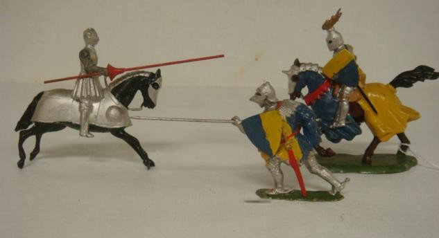 Three Vintage BRITAIN'S 54mm Knights Toy Soldiers:: Three Vintage BRITAIN'S 54mm Knights Toy Soldiers: Two Mounted Knights on Charging with Sword and One with Spear. Foot Knight with Spear and Shield. Very Good Condition Handpainted Toy Soldiers. (100-