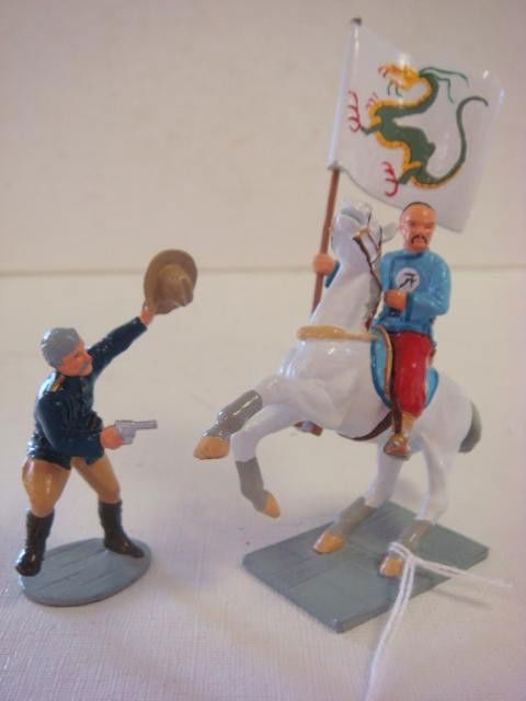 TROPHY MINIATURES WALES LTD, 55 DAYS AT PEKING 54m: TROPHY MINIATURES WALES LTD, 55 DAYS AT PEKING 54mm: Maj. Matt Lewis (Charlton Heston) Draws down on Mounted Boxer Color Bearer with Dragon Flag. Handpainted 54mm Toy Soldiers. Where is Baroness Ivano