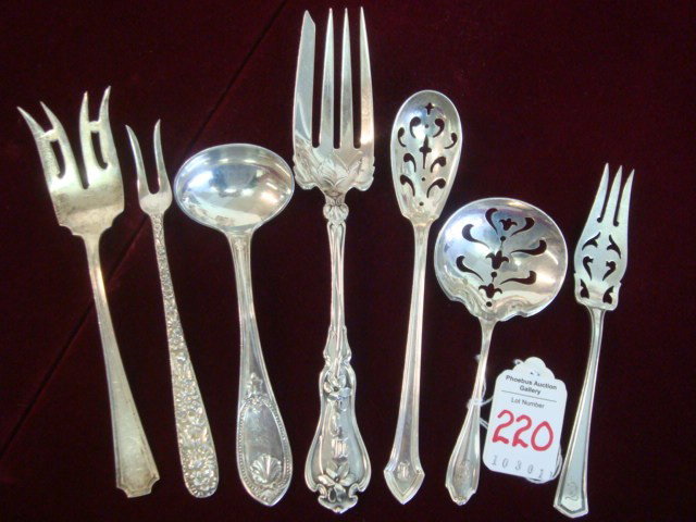 Six Assorted Sterling Silver Serving Spoons and Fo: Six Assorted Sterling Silver Serving Spoons and Forks: Whiting Violet Serving Fork and Stratford Nut Spoon, Durgin Essex Olive Spoon and Fairfax Meat Fork, Kirk Repousse Pickle Fork and Mauser Lemon F