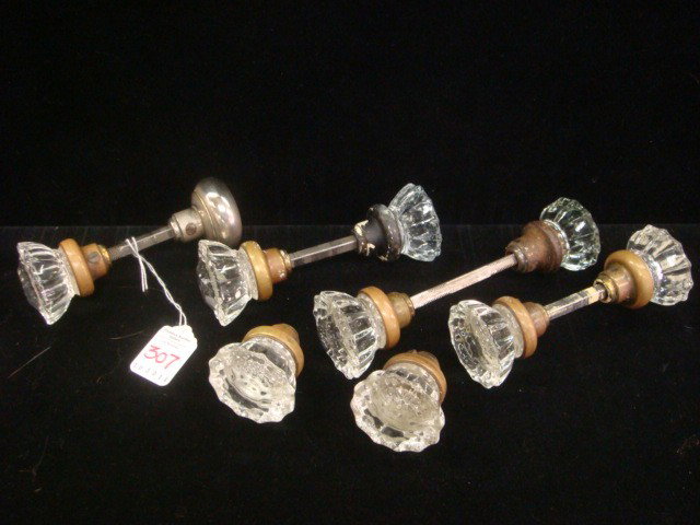 Five Glass With Metal Vintage Door Knob Sets:: Five Glass With Metal Vintage Door Knob Sets: Clear Faceted Glass with Rosette Centers. Thread Holes for Mounting. Four Have Attaching Rods. 4 1/2 Sets. (80-150)