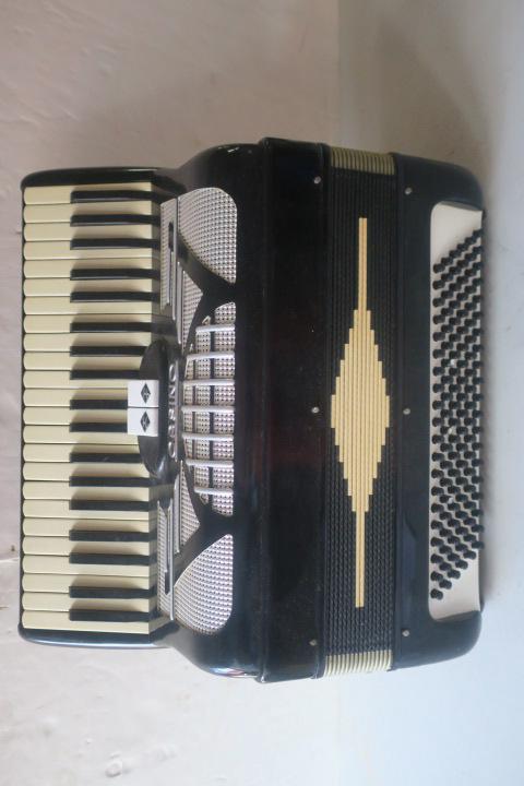 Vintage Italian Casino Piano Accordion:: Vintage Italian Casino Piano Accordion: 2 Treble Switches, Silver Grill, 16 Fold Bellows, 120 Bass Buttons, 24 White and 17 Black Keys. Original Straps. Surface Wear. Not Tested. Serial #C55077. (150-
