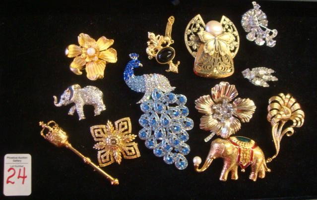 Signed and Unsigned Brooches, Some Rhinestone:: Signed and Unsigned Brooches, Some Rhinestone: Includes Modern Blue Rhinestone Peacock, Monet Elephant, 3-D Elephant, Eisenberg Flower, Jane Angel, Dogwood with Pearl Center, etc. (80-150)