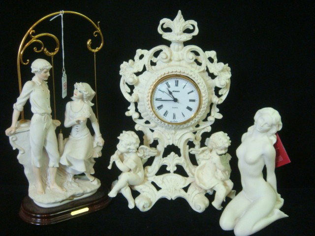 Composition Clock Frame, Armani and Greek Figurine: Composition Clock Frame, Armani and Greek Figurines: Clock Frame is 13 3/4"T with German Staiger Quartz Clock. Repair to Cherub Horn, Some Stains. Giuseppe Armani Girl on Swing with Boy, Signed on Bac