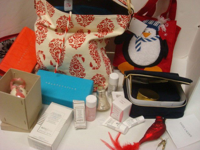 STEPHANIE JOHNSON Tote, JAY STRONGWATER Compact: STEPHANIE JOHNSON Tote, JAY STRONGWATER Compact: Estee Lauder Makeup in Suede Case, Penguin Gift Bag, Holiday Ornaments, Sisley Makeup in Bag, Egg Ornament, Hand Towel, Cartier Cologne. Powder Case is
