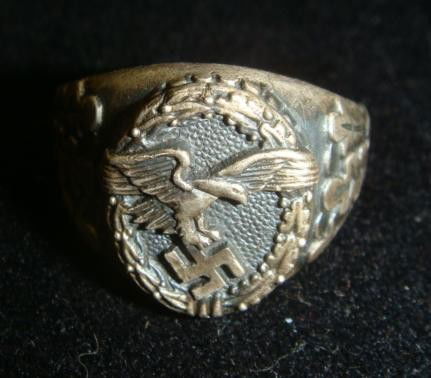 German Nazi Luftwaffe Silver Ring: German Nazi Luftwaffe Silver Ring Marked 835 and with Makers Initials. German WW II German Air force Ring is .4 OZs of German Sterling Silver. Features Air force Eagle and Oak Leaves in Very Deco Desi