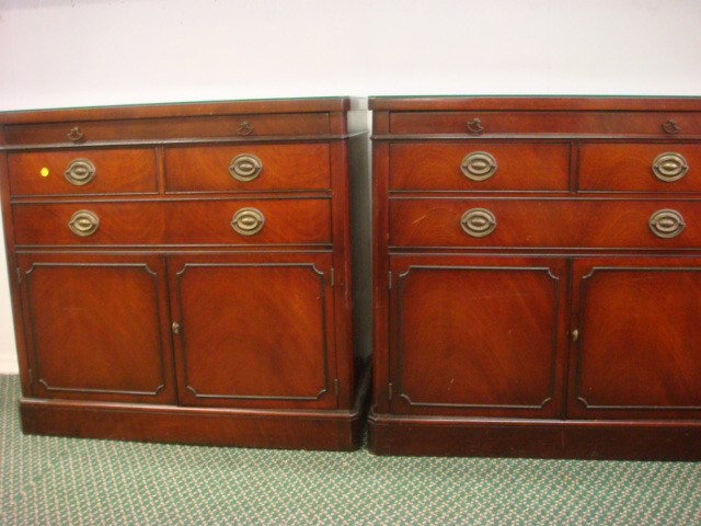 Pair of DREXEL Mahogany Servers:: Pair of DREXEL Mahogany Servers: Each has Pull Out Tray Over Two Short Drawers and One Long Drawer Over Double Blind Doors. Custom Glass Tops. Brass Hardware. 33 1/2"T, 36"W, 18"D. (600-900)