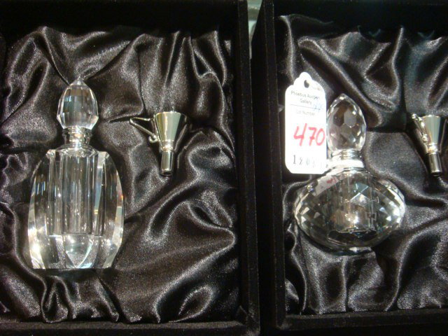 Two Crystal Perfume Bottles in Presentation Boxes:: Two Crystal Perfume Bottles in Presentation Boxes: One Diamond Patterned and the Other Paneled. Both with Funnels and Silver Collar. 2 1/2" and 3 1/2"T. New in Box. (50-80)