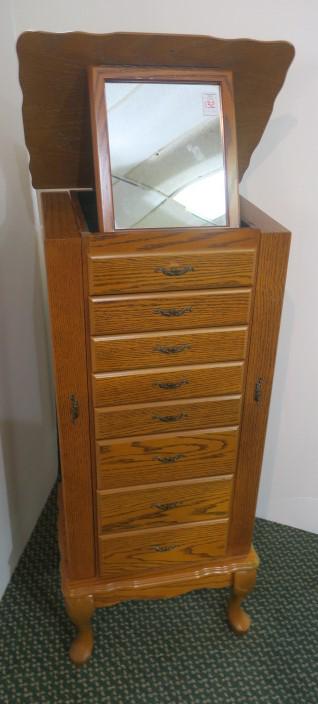 L Powell Oak Finish Jewelry Armoire:: L Powell Oak Finish Jewelry Armoire: Free Standing, Patented 1988. 8 Green Felt Lined Compartmented Drawers. Hinged Top Opens to Reveal Tilt Mirror. Sides Open with Necklace Hooks. On Cabriole Legs wi