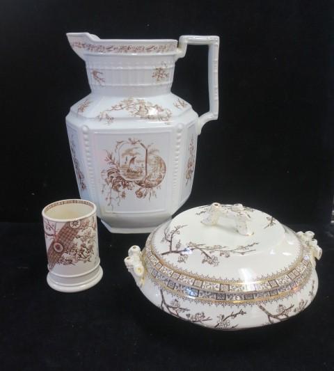 Three Antique Brown Transferware Ceramic Items:: Three Antique Brown Transferware Ceramic Items: EJD Bodley "Thorn" Lidded Tureen, Burslem England CA 1882. Twig Handles. Minor Staining Inside. Gold Accents. 11"D. J.H. Davis "Sylvan" Water Pitcher, R
