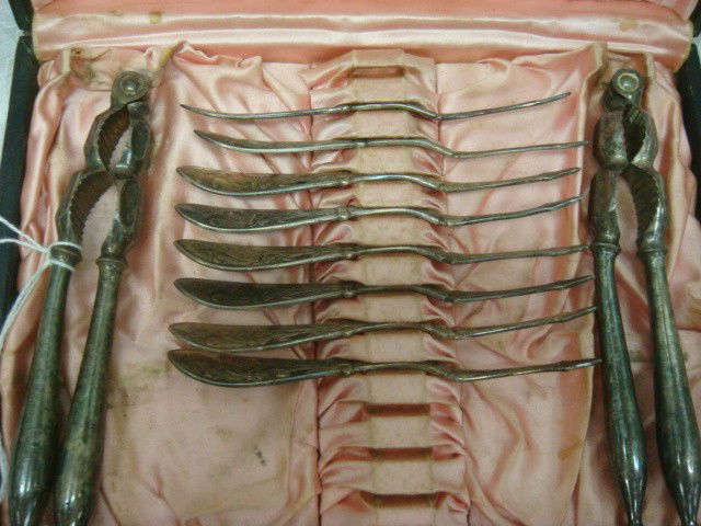 Silver-plate Nut Set and DUNHILL Lighter in Case: Silver-plate Nut Set and DUNHILL Lighter in Case: Pink Satin Lined Case Holds 2 Nut Crackers and 8 Picks with Squirrel Handles. Silver-plate Dunhill Lighter Marked Sylph (100-200)