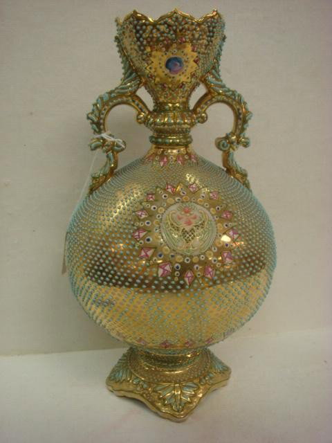 COALPORTIA NIPPON Heavy Enamel Beaded Handled Vase: COALPORTIA NIPPON Heavy Enamel Beaded Handled Vase: Green Enamel Beading on Gold Ground with Sun Medallion and Figural Bird in Center. Double Scroll Handles, Pedestal Foot. (200-300)