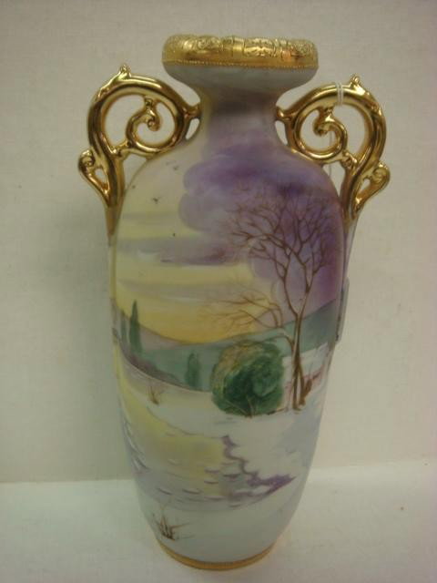 Hand Painted NIPPON Double Handled Vase:: Hand Painted NIPPON Double Handled Vase: Baluster Vase with Hand Painted Snowy Landscape Scene. Gold Handles and Rims. 9 3/4"T. Green M in Wreath Mark. (200-300)