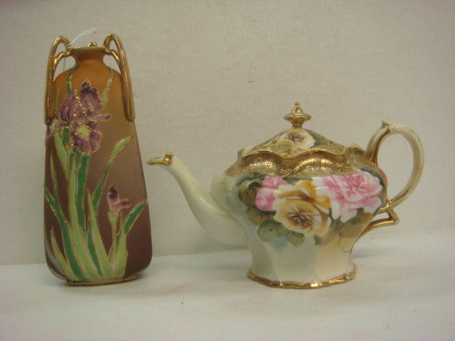 Hand Painted NIPPON Iris Vase and Teapot: Hand Painted NIPPON Iris Vase and Teapot: Three Handled Triangular Vase has Enameled Iris and Leaves. Gold Handled. Green M in Wreath Mark. Repair to One Handle. 7 1/4"T. Teapot has Hand Painted Rouse