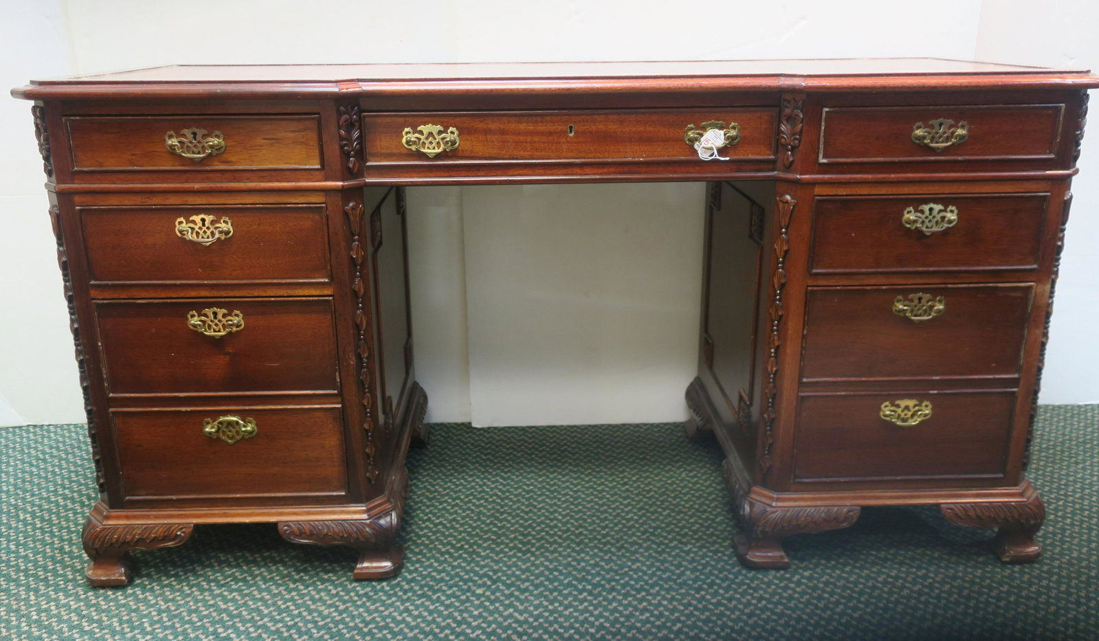 Leather Top Mahogany Seven Drawer Desk:: Leather Top Mahogany Seven Drawer Desk: English Influenced Executive Knee Hole Desk with 3 Drawers on Each Side (2 File) Flanking Single Centered Drawer with Cast Brass Pulls. Gold Tooled Top is 62"W 