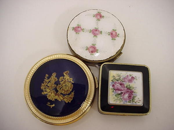 3 Vintage Enamel Top Compacts: 3 Vintage Enamel Top Compacts: 3"D Cobalt Topped Brass Frame Limoges, 2 1/4" Square Nouveau Design with Black Painted Brass Case Having Floral Painted Enamel Center and Flair. 3/4"D Rose Enamel Topped
