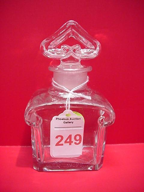 Guerlain Baccarat Mitsouko Crystal Scent Bottle: Guerlain Baccarat Mitsouko Crystal Scent Bottle: 4 3/4". Stopper Made in Shape of Gendarmes Hat. Name Etched on Base and Number on Inside of Stopper. For Detail Condition Report call 757 722-9210. Bid