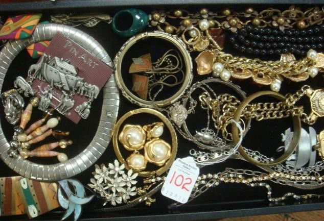 Collection of Costume Jewelry: Collection of Costume Jewelry: Includes Clip and Pierced Earrings, Noah's Ark Pins, 6 Silver and Gold Tone Chain Bracelets, Gold Tone Charm Bracelet, Medallion Necklace, 4 Bangle Bracelets and More. (