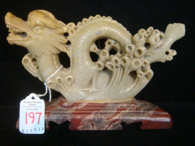 Carved Asian Soapstone Dragon Figure:: Carved Asian Soapstone Dragon Figure: Fierce Dragon is Feng Shui Symbol of Power. Relief Carved on Front, Set on Contrasting Notched Base. 7 1/2"L X 5"T. (60-100)