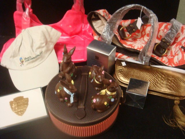 Red and Cream Canvas ESTEE LAUDER Tote with Makeup: Red and Cream Canvas ESTEE LAUDER Tote with Makeup: Pink Neiman Marcus Purse, 2 Estee Lauder Makeup Cases, Dior Lip Gloss, Renutriv Cream, 4 Bunny Figurines, Disney Visor Cap, Eliza and Lacoste Belts,