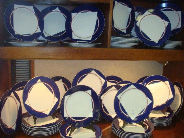 Seventy VILLEROY & BOCH Dinner Plates: Seventy VILLEROY & BOCH Dinner Plates: Plates are 11 1/2" Diameter with Cobalt Edge, White Center with Red Band. Marked Luxemburg 0136F Adam Tihany Ltd. From Blue Hippo Restaurant. (150-300)