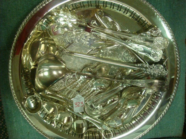 Silver Plate Tray with 41 Assorted Flatware Pieces: Silver Plate Tray with 41 Assorted Flatware Pieces: Tray with Pierced sides is 16 1/2"D. Two Ladles, 2 Spaghetti Servers, Asparagus Server, Nut Cracker, 2 Pie Servers, Candle Snuffer, 12 Ice Cream Spo