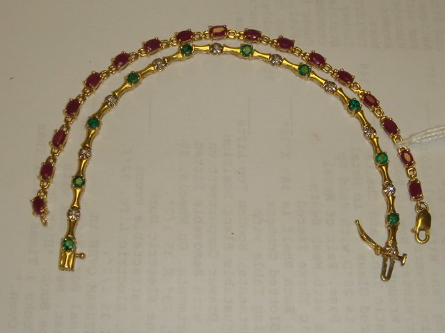 Two 14K Ruby, Diamond and Emerald Bracelets: Two 14K Ruby, Diamond and Emerald Bracelets: Each Bracelet Measures 7"L, One Set with 17 Oval Rubies, wt. 3 1/2CTS. Other Set with 9 Round Emeralds, wt. 1 1/2CTS and 10 Small Diamonds. Each has Safety