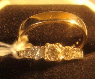 Diamond Wedding Set in 14K White Gold: Diamond Wedding Set in 14K White Gold: Size 8 1/2 - Has Engagement Ring Set with 1/4 CT Center Stone Flanked by 1/5 CT Round Stones & Having 6 Smaller Channel set Stones on Band. Wedding Band with 12