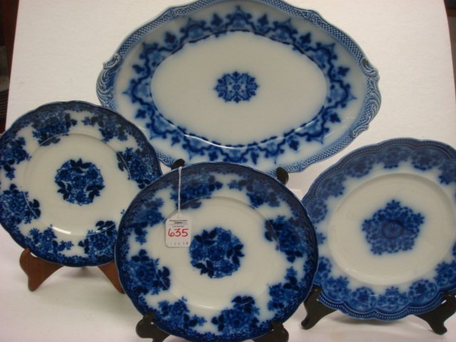 Three Flow Blue Plates and a Platter: Three Flow Blue Plates and a Platter: Two New Wharf Pottery "Waldorf" 9" Plates, Johnson Bros "Regent" 10" Scalloped Plate (Rim Chip), Grindley 1891-1914 15" Oval Platter with Fish Scale Rim. (120-220