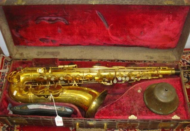 1955 HN WHITE King Zephyr Tenor Saxophone in Case:: 1955 HN WHITE King Zephyr Tenor Saxophone in Case: Serial #354,635. Engraved Bell is 6 1/4" Diameter. Made in Ohio. Lacquered Brass, Some Wear, Mother of Pearl Keys, Mouth Piece, Fitted Case. (500-900