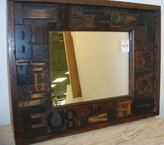 Mirror with Vintage Wooden Print Press Letters: Mirror with Vintage Wooden Print Press Letters: Variety of Fonts and Sizes of Type Set Letters and Numbers Used as Frame. 19" X 15" Overall. Letters From 1880-1920. Purchased From Old Press Prints, Lo