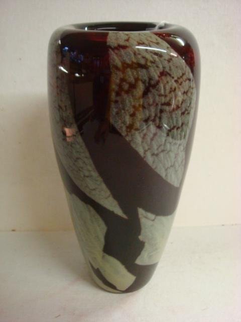 Contemporary Free Blown Signed Art Glass Vase: Contemporary Free Blown Signed Art Glass Vase: Blended Gray Green Leaves on Dark Translucent Ruby Vase. 10"T with Rolled Lip and Broken Pontil. Artist Signed on Punt Mark. (100-200)