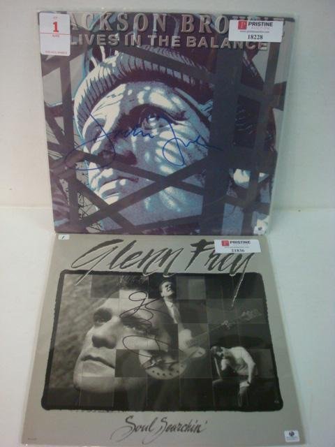 Two Autographed Album Cover Frey and Brown:: Two Autographed Album Cover Frey and Brown: Jackson Brown "Lives in the Balance" and Glenn Frey "Soul Searching." Signed on Front With Letter of Authenticity. No Record. Very Good Condition. (60-120)