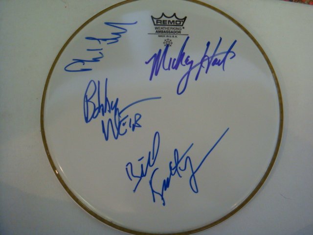 GRATEFUL DEAD Signed Drumhead:: GRATEFUL DEAD Signed Drumhead: Grateful Dead band Members Phil Lesh, Bob Weir, Mickey Hart & Bill Kreutzmann Have Signed this Drumhead in Blue Sharpe Pen. Measures 10 1/2" in Diameter, Very Good Condi