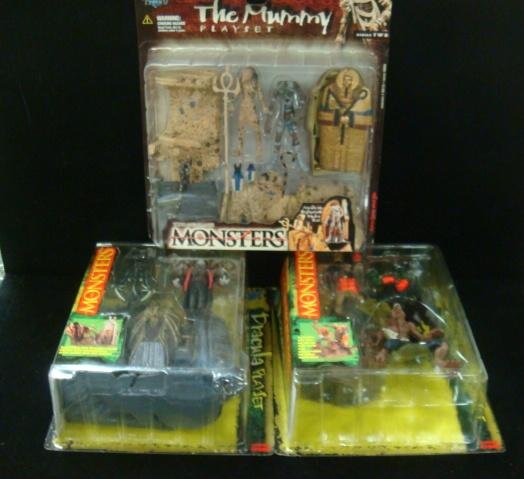 Todd McFarlane Monsters Action Figures:: Todd McFarlane Monsters Action Figures: Dracula, Werewolf and Mummy Play Sets. Mint in Boxes. (50-100)