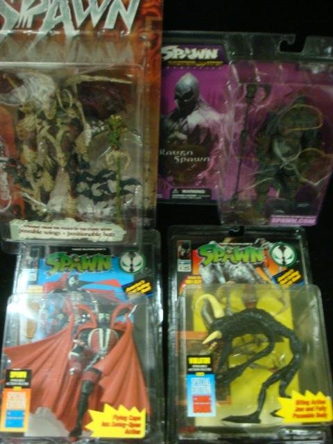 Four Todd McFarlane SPAWN Action Figures:: Four Todd McFarlane SPAWN Action Figures: The Violator, Spawn with Special Edition Comic Books, Raven Spawn and Curse of the Spawn. Mint in Boxes. (50-100)