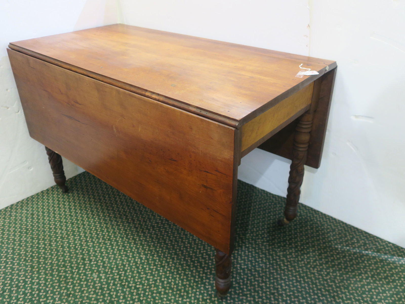 Antique Sheraton Cherry Drop Leaf Table:: Antique Sheraton Cherry Drop Leaf Table: Double Drops with Pull Out Supports. Birds Eye Maple Panels on Each End. Leaf Carved Legs Ending in Brass Castors. Top Has 2 Boards, One 18"W and One 3 1/2"w.