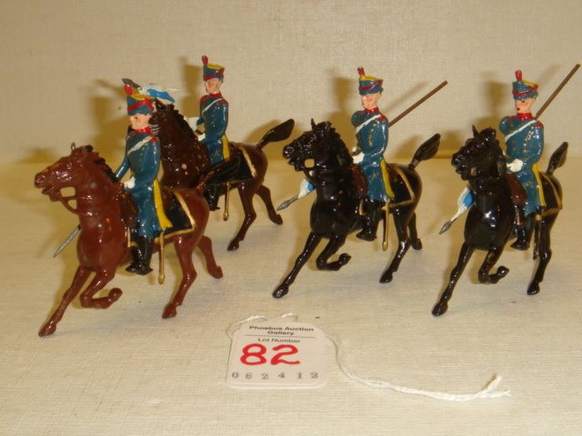 Four BRITAINS Prussian Lancers Toy Soldiers on Hors: Four BRITAINS Prussian Lancers Toy Soldiers on Horses: Green Uniformed Lancers with Grey and White Pinions, Gray Caps with Yellow Tops. On Brown and Black Horses. Very Good Condition, No Box. (75-150)